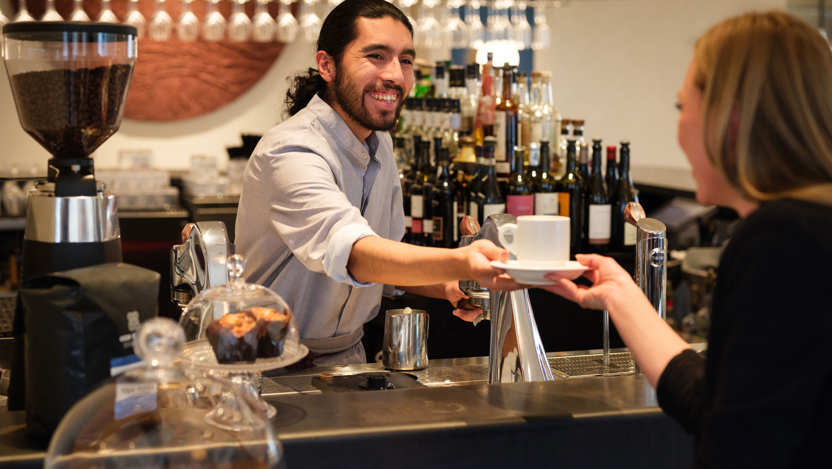 Bartender making fresh coffee at the Coffee Bar at Lobby Bar