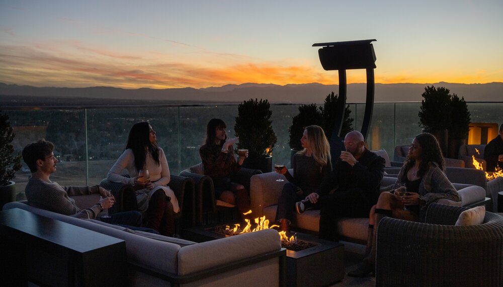 guests at Halo Rooftop Bar during sunset